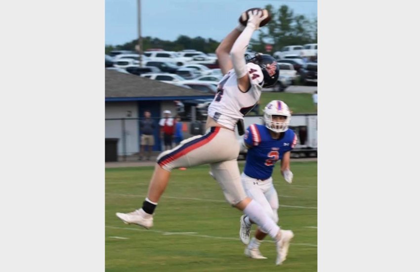 Leake Academy’s Aiden Watkins goes up to make a big catch against Starkville Academy on Friday.